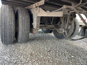 Truck tandem axle and dual tires over gravel