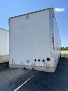 Rear view of a 53-foot Hyundai trailer with some wear and dirt marks.